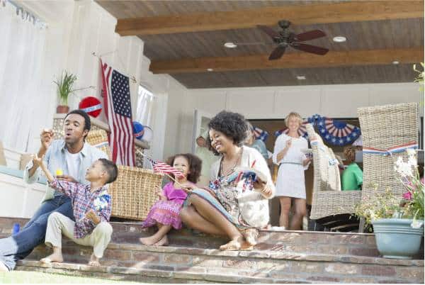 Independence day family event on front steps of home