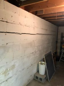 straight and horizontal wall crack in basement foundation