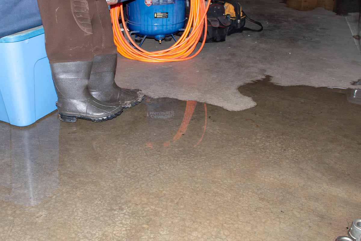 water in basement with engineer in boots